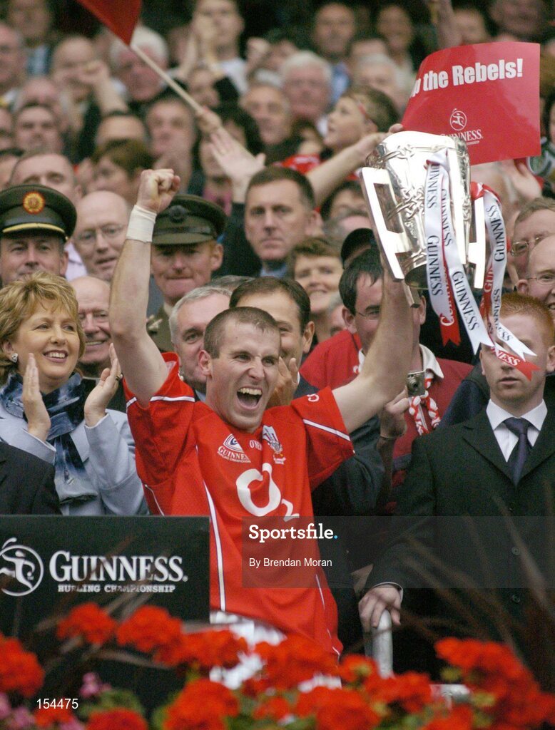 12 September 2004; Cork captain Ben O'Connor celebrates with the Liam MacCarthy cup after victory over Kilkenny. Guinness All-Ireland Senior Hurling Championship Final, Cork v Kilkenny, Croke Park, Dublin. Picture credit; Brendan Moran / SPORTSFILE *** Local Caption *** Any photograph taken by SPORTSFILE during, or in connection with, the 2004 Guinness All-Ireland Hurling Final which displays GAA logos or contains an image or part of an image of any GAA intellectual property, or, which contains images of a GAA player/players in their playing uniforms, may only be used for editorial and non-advertising purposes.  Use of photographs for advertising, as posters or for purchase separately is strictly prohibited unless prior written approval has been obtained from the Gaelic Athletic Association.