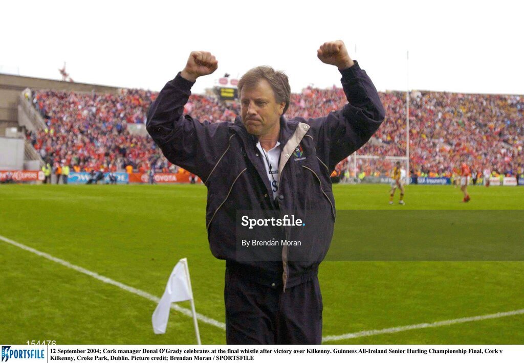12 September 2004; Cork manager Donal O'Grady celebrates at the final whistle after victory over Kilkenny. Guinness All-Ireland Senior Hurling Championship Final, Cork v Kilkenny, Croke Park, Dublin. Picture credit; Brendan Moran / SPORTSFILE *** Local Caption *** Any photograph taken by SPORTSFILE during, or in connection with, the 2004 Guinness All-Ireland Hurling Final which displays GAA logos or contains an image or part of an image of any GAA intellectual property, or, which contains images of a GAA player/players in their playing uniforms, may only be used for editorial and non-advertising purposes.  Use of photographs for advertising, as posters or for purchase separately is strictly prohibited unless prior written approval has been obtained from the Gaelic Athletic Association.