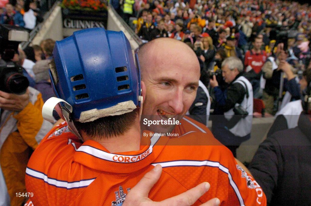 12 September 2004; Cork's Brian Corcoran celebrates with team-mate Tom Kenny at the final whistle after victory over Kilkenny. Guinness All-Ireland Senior Hurling Championship Final, Cork v Kilkenny, Croke Park, Dublin. Picture credit; Brendan Moran / SPORTSFILE *** Local Caption *** Any photograph taken by SPORTSFILE during, or in connection with, the 2004 Guinness All-Ireland Hurling Final which displays GAA logos or contains an image or part of an image of any GAA intellectual property, or, which contains images of a GAA player/players in their playing uniforms, may only be used for editorial and non-advertising purposes.  Use of photographs for advertising, as posters or for purchase separately is strictly prohibited unless prior written approval has been obtained from the Gaelic Athletic Association.