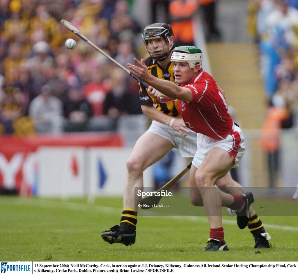 12 September 2004; Niall McCarthy, Cork, in action against J.J. Delaney, Kilkenny. Guinness All-Ireland Senior Hurling Championship Final, Cork v Kilkenny, Croke Park, Dublin. Picture credit; Brian Lawless / SPORTSFILE *** Local Caption *** Any photograph taken by SPORTSFILE during, or in connection with, the 2004 Guinness All-Ireland Hurling Final which displays GAA logos or contains an image or part of an image of any GAA intellectual property, or, which contains images of a GAA player/players in their playing uniforms, may only be used for editorial and non-advertising purposes.  Use of photographs for advertising, as posters or for purchase separately is strictly prohibited unless prior written approval has been obtained from the Gaelic Athletic Association.