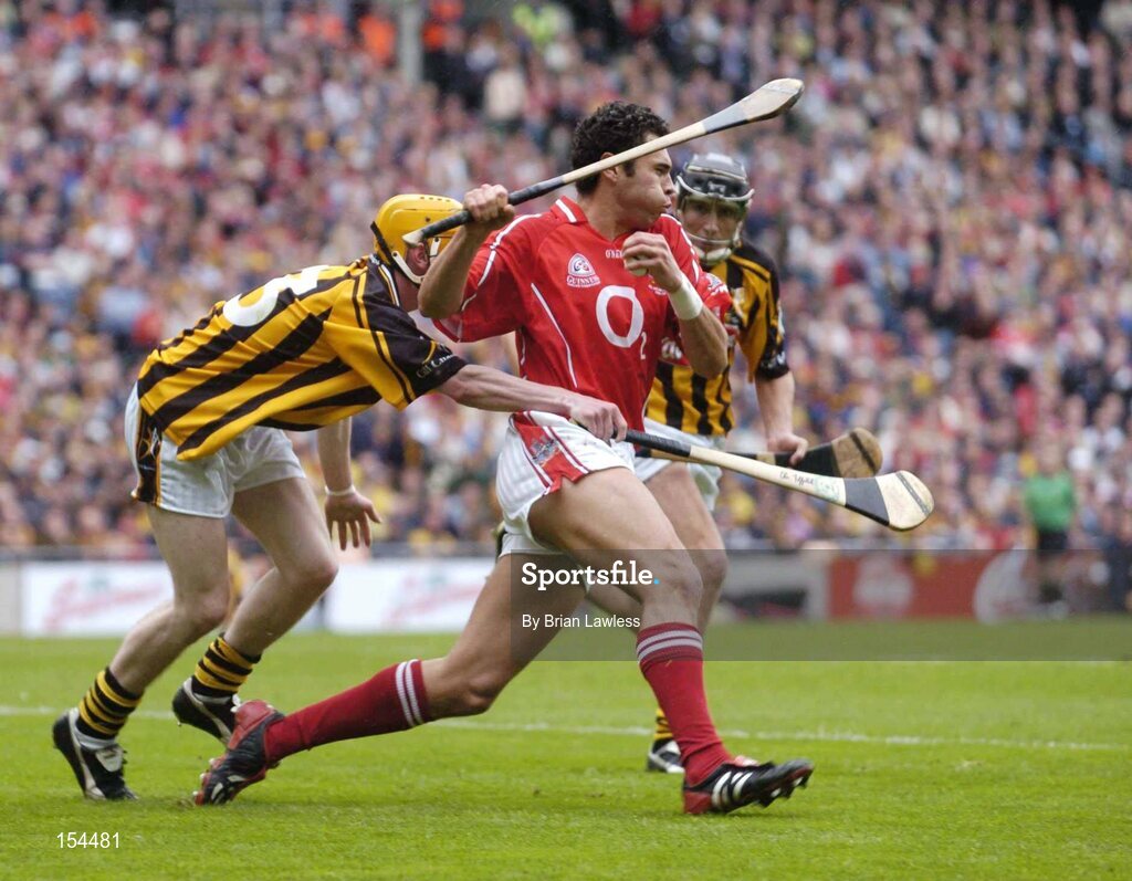 12 September 2004; Sean Og O hAilpin, Cork, in action against James 'Cha' Fitzpatrick, Kilkenny. Guinness All-Ireland Senior Hurling Championship Final, Cork v Kilkenny, Croke Park, Dublin. Picture credit; Brian Lawless / SPORTSFILE *** Local Caption *** Any photograph taken by SPORTSFILE during, or in connection with, the 2004 Guinness All-Ireland Hurling Final which displays GAA logos or contains an image or part of an image of any GAA intellectual property, or, which contains images of a GAA player/players in their playing uniforms, may only be used for editorial and non-advertising purposes.  Use of photographs for advertising, as posters or for purchase separately is strictly prohibited unless prior written approval has been obtained from the Gaelic Athletic Association.