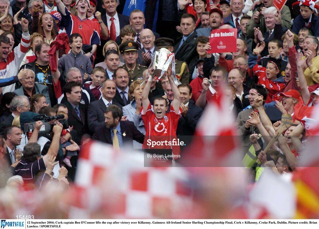 12 September 2004; Cork captain Ben O'Connor lifts the Liam MacCarthy cup after victory over Kilkenny. Guinness All-Ireland Senior Hurling Championship Final, Cork v Kilkenny, Croke Park, Dublin. Picture credit; Brian Lawless / SPORTSFILE *** Local Caption *** Any photograph taken by SPORTSFILE during, or in connection with, the 2004 Guinness All-Ireland Hurling Final which displays GAA logos or contains an image or part of an image of any GAA intellectual property, or, which contains images of a GAA player/players in their playing uniforms, may only be used for editorial and non-advertising purposes.  Use of photographs for advertising, as posters or for purchase separately is strictly prohibited unless prior written approval has been obtained from the Gaelic Athletic Association.