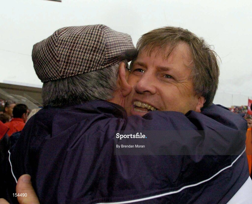 12 September 2004; Cork manager Donal O'Grady celebrates after victory over Kilkenny. Guinness All-Ireland Senior Hurling Championship Final, Cork v Kilkenny, Croke Park, Dublin. Picture credit; Brendan Moran / SPORTSFILE *** Local Caption *** Any photograph taken by SPORTSFILE during, or in connection with, the 2004 Guinness All-Ireland Hurling Final which displays GAA logos or contains an image or part of an image of any GAA intellectual property, or, which contains images of a GAA player/players in their playing uniforms, may only be used for editorial and non-advertising purposes.  Use of photographs for advertising, as posters or for purchase separately is strictly prohibited unless prior written approval has been obtained from the Gaelic Athletic Association.