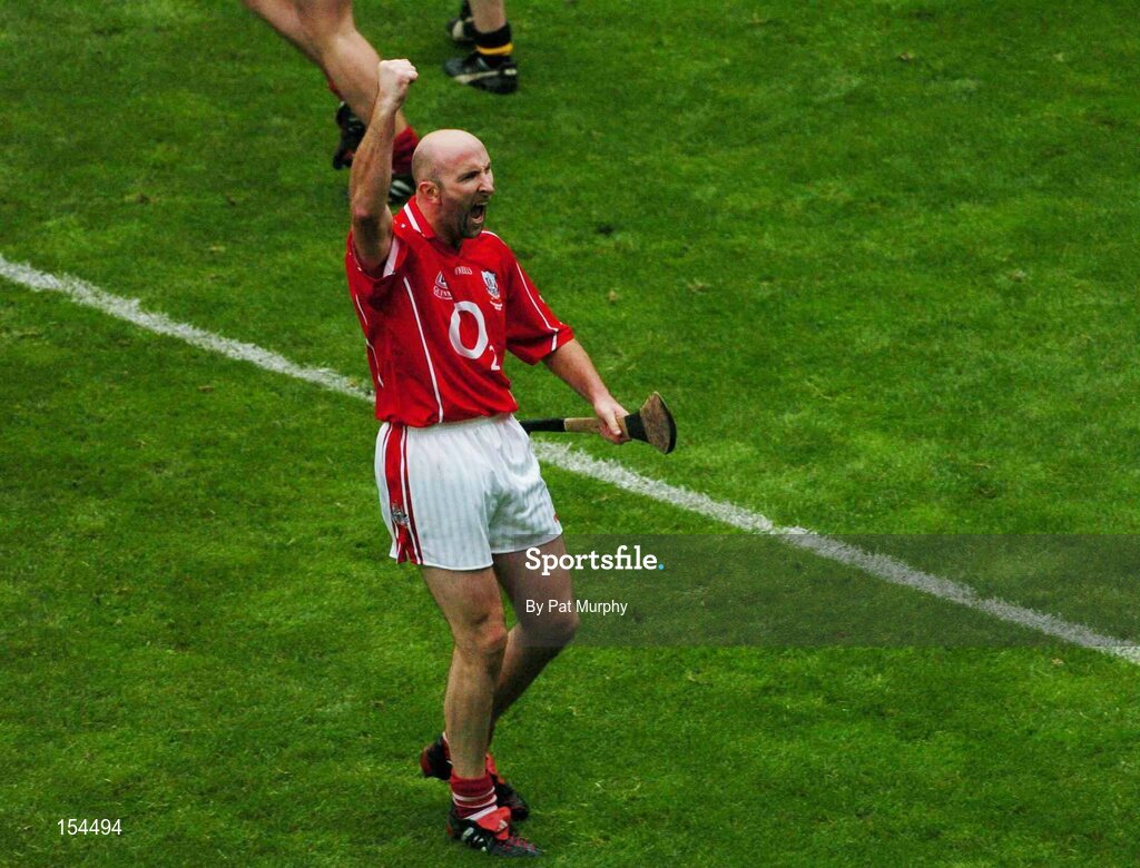 12 September 2004; Cork's Brian Corcoran celebrates at the final whistle. Guinness All-Ireland Senior Hurling Championship Final, Cork v Kilkenny, Croke Park, Dublin. Picture credit; Pat Murphy / SPORTSFILE *** Local Caption *** Any photograph taken by SPORTSFILE during, or in connection with, the 2004 Guinness All-Ireland Hurling Final which displays GAA logos or contains an image or part of an image of any GAA intellectual property, or, which contains images of a GAA player/players in their playing uniforms, may only be used for editorial and non-advertising purposes.  Use of photographs for advertising, as posters or for purchase separately is strictly prohibited unless prior written approval has been obtained from the Gaelic Athletic Association.