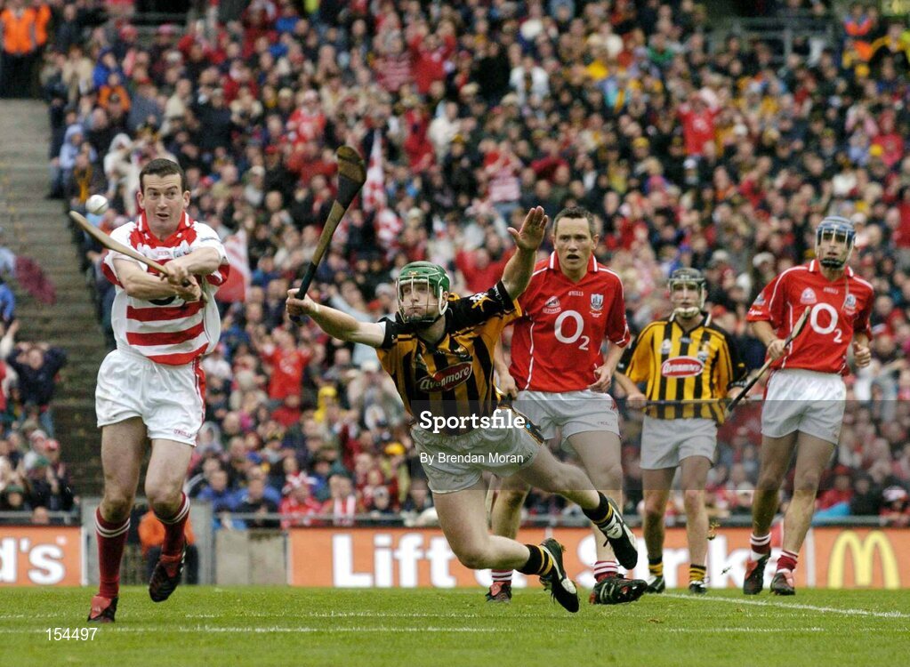 12 September 2004; Donal Og Cusack, Cork, in action against Henry Shefflin, Kilkenny. Guinness All-Ireland Senior Hurling Championship Final, Cork v Kilkenny, Croke Park, Dublin. Picture credit; Brendan Moran / SPORTSFILE *** Local Caption *** Any photograph taken by SPORTSFILE during, or in connection with, the 2004 Guinness All-Ireland Hurling Final which displays GAA logos or contains an image or part of an image of any GAA intellectual property, or, which contains images of a GAA player/players in their playing uniforms, may only be used for editorial and non-advertising purposes.  Use of photographs for advertising, as posters or for purchase separately is strictly prohibited unless prior written approval has been obtained from the Gaelic Athletic Association.