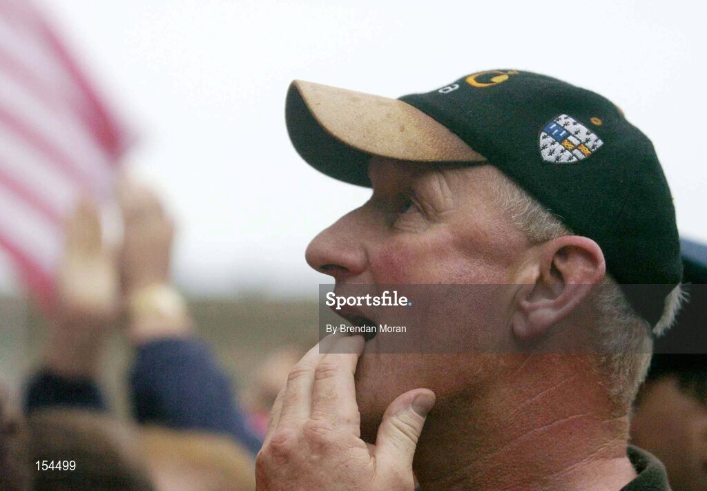 12 September 2004; Kilkenny manager Brian Cody watches as Cork captain Ben O'Connor lifts the Liam MacCarthy cup. Guinness All-Ireland Senior Hurling Championship Final, Cork v Kilkenny, Croke Park, Dublin. Picture credit; Brendan Moran / SPORTSFILE *** Local Caption *** Any photograph taken by SPORTSFILE during, or in connection with, the 2004 Guinness All-Ireland Hurling Final which displays GAA logos or contains an image or part of an image of any GAA intellectual property, or, which contains images of a GAA player/players in their playing uniforms, may only be used for editorial and non-advertising purposes.  Use of photographs for advertising, as posters or for purchase separately is strictly prohibited unless prior written approval has been obtained from the Gaelic Athletic Association.