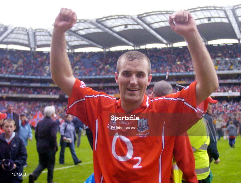 12 September 2004; Cork's Jerry O'Connor celebrates after victory over Kilkenny. Guinness All-Ireland Senior Hurling Championship Final, Cork v Kilkenny, Croke Park, Dublin. Picture credit; Brian Lawless / SPORTSFILE *** Local Caption *** Any photograph taken by SPORTSFILE during, or in connection with, the 2004 Guinness All-Ireland Hurling Final which displays GAA logos or contains an image or part of an image of any GAA intellectual property, or, which contains images of a GAA player/players in their playing uniforms, may only be used for editorial and non-advertising purposes.  Use of photographs for advertising, as posters or for purchase separately is strictly prohibited unless prior written approval has been obtained from the Gaelic Athletic Association.