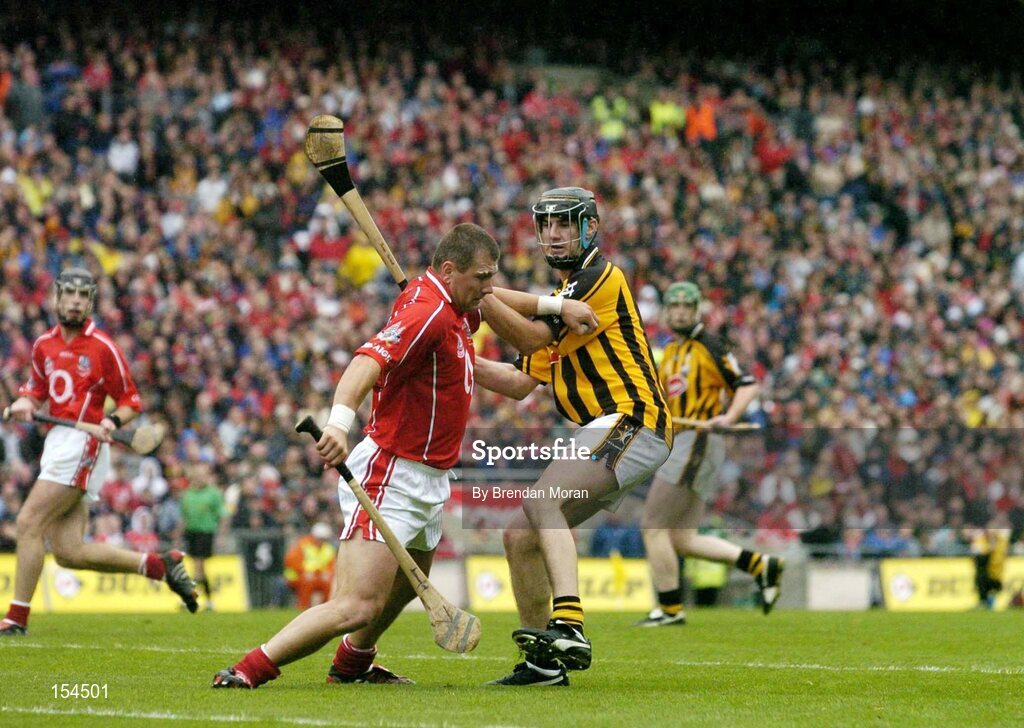 12 September 2004; Diarmuid O'Sullivan, Cork, retains possession as he holds off John Hoyne, Kilkenny. Guinness All-Ireland Senior Hurling Championship Final, Cork v Kilkenny, Croke Park, Dublin. Picture credit; Brendan Moran / SPORTSFILE *** Local Caption *** Any photograph taken by SPORTSFILE during, or in connection with, the 2004 Guinness All-Ireland Hurling Final which displays GAA logos or contains an image or part of an image of any GAA intellectual property, or, which contains images of a GAA player/players in their playing uniforms, may only be used for editorial and non-advertising purposes.  Use of photographs for advertising, as posters or for purchase separately is strictly prohibited unless prior written approval has been obtained from the Gaelic Athletic Association.