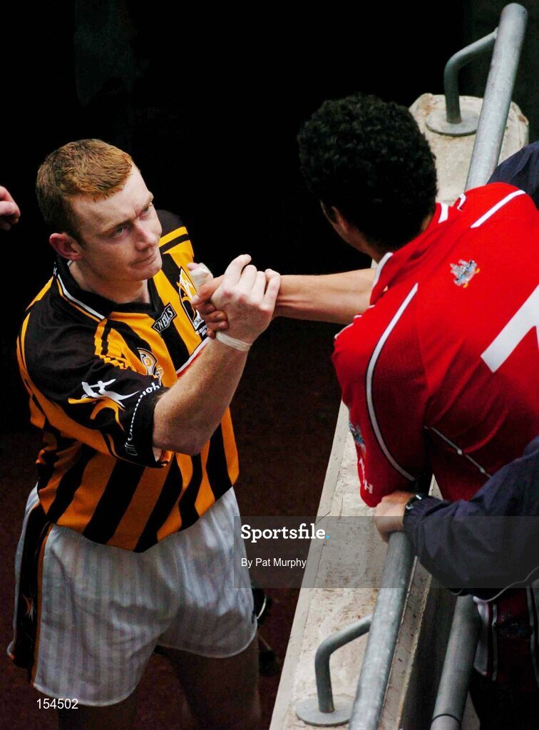 12 September 2004; Sean Og O'hAilpin, Cork, is congratulated by Kilkenny's Peter Barry after the game. Guinness All-Ireland Senior Hurling Championship Final, Cork v Kilkenny, Croke Park, Dublin. Picture credit; Pat Murphy / SPORTSFILE *** Local Caption *** Any photograph taken by SPORTSFILE during, or in connection with, the 2004 Guinness All-Ireland Hurling Final which displays GAA logos or contains an image or part of an image of any GAA intellectual property, or, which contains images of a GAA player/players in their playing uniforms, may only be used for editorial and non-advertising purposes.  Use of photographs for advertising, as posters or for purchase separately is strictly prohibited unless prior written approval has been obtained from the Gaelic Athletic Association.