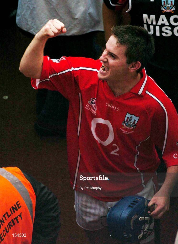 12 September 2004; Tom Kenny, Cork, celebrates after victory over Kilkenny. Guinness All-Ireland Senior Hurling Championship Final, Cork v Kilkenny, Croke Park, Dublin. Picture credit; Pat Murphy / SPORTSFILE *** Local Caption *** Any photograph taken by SPORTSFILE during, or in connection with, the 2004 Guinness All-Ireland Hurling Final which displays GAA logos or contains an image or part of an image of any GAA intellectual property, or, which contains images of a GAA player/players in their playing uniforms, may only be used for editorial and non-advertising purposes.  Use of photographs for advertising, as posters or for purchase separately is strictly prohibited unless prior written approval has been obtained from the Gaelic Athletic Association.