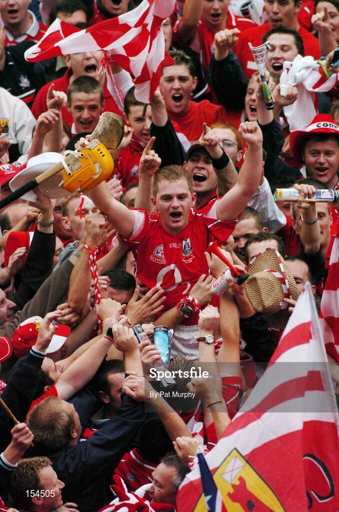 12 September 2004; Joe Deane, Cork, is held shoulder high after victory over Kilkenny. Guinness All-Ireland Senior Hurling Championship Final, Cork v Kilkenny, Croke Park, Dublin. Picture credit; Pat Murphy / SPORTSFILE *** Local Caption *** Any photograph taken by SPORTSFILE during, or in connection with, the 2004 Guinness All-Ireland Hurling Final which displays GAA logos or contains an image or part of an image of any GAA intellectual property, or, which contains images of a GAA player/players in their playing uniforms, may only be used for editorial and non-advertising purposes.  Use of photographs for advertising, as posters or for purchase separately is strictly prohibited unless prior written approval has been obtained from the Gaelic Athletic Association.