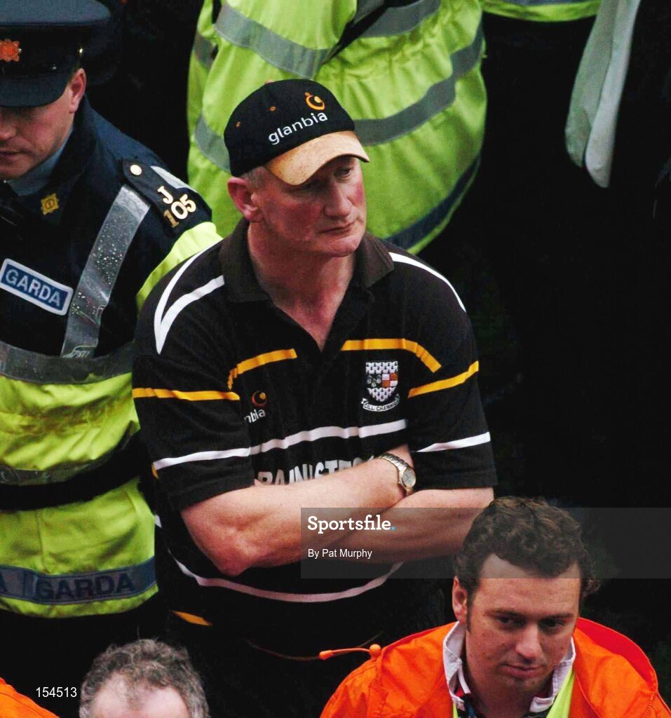 12 September 2004; Brian Cody, Kilkenny manager, shows his dissapointment at the end of the game. Guinness All-Ireland Senior Hurling Championship Final, Cork v Kilkenny, Croke Park, Dublin. Picture credit; Pat Murphy / SPORTSFILE *** Local Caption *** Any photograph taken by SPORTSFILE during, or in connection with, the 2004 Guinness All-Ireland Hurling Final which displays GAA logos or contains an image or part of an image of any GAA intellectual property, or, which contains images of a GAA player/players in their playing uniforms, may only be used for editorial and non-advertising purposes.  Use of photographs for advertising, as posters or for purchase separately is strictly prohibited unless prior written approval has been obtained from the Gaelic Athletic Association.