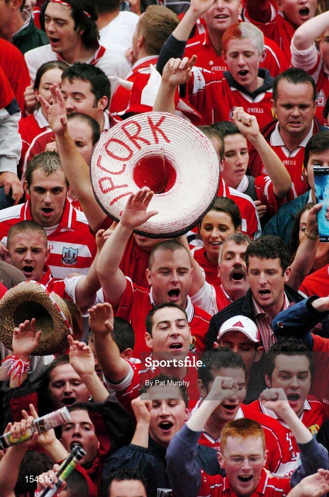 12 September 2004; Cork fans celebrate victory over Kilkenny. Guinness All-Ireland Senior Hurling Championship Final, Cork v Kilkenny, Croke Park, Dublin. Picture credit; Pat Murphy / SPORTSFILE *** Local Caption *** Any photograph taken by SPORTSFILE during, or in connection with, the 2004 Guinness All-Ireland Hurling Final which displays GAA logos or contains an image or part of an image of any GAA intellectual property, or, which contains images of a GAA player/players in their playing uniforms, may only be used for editorial and non-advertising purposes.  Use of photographs for advertising, as posters or for purchase separately is strictly prohibited unless prior written approval has been obtained from the Gaelic Athletic Association.