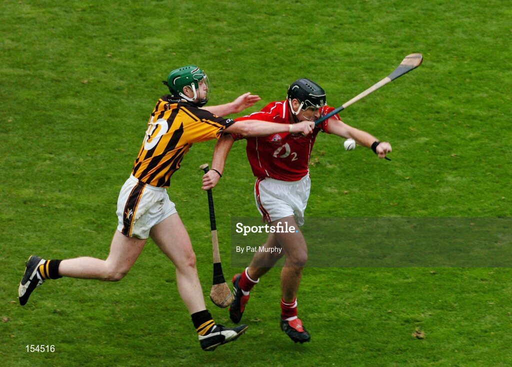 12 September 2004; Ronan Curran, Cork, in action against Henry Shefflin, Kilkenny. Guinness All-Ireland Senior Hurling Championship Final, Cork v Kilkenny, Croke Park, Dublin. Picture credit; Pat Murphy / SPORTSFILE *** Local Caption *** Any photograph taken by SPORTSFILE during, or in connection with, the 2004 Guinness All-Ireland Hurling Final which displays GAA logos or contains an image or part of an image of any GAA intellectual property, or, which contains images of a GAA player/players in their playing uniforms, may only be used for editorial and non-advertising purposes.  Use of photographs for advertising, as posters or for purchase separately is strictly prohibited unless prior written approval has been obtained from the Gaelic Athletic Association.