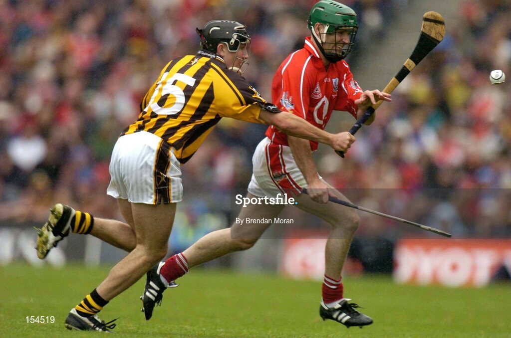 12 September 2004; Jerry O'Connor, Cork, in action against Eddie Brennan, Kilkenny. Guinness All-Ireland Senior Hurling Championship Final, Cork v Kilkenny, Croke Park, Dublin. Picture credit; Brendan Moran / SPORTSFILE *** Local Caption *** Any photograph taken by SPORTSFILE during, or in connection with, the 2004 Guinness All-Ireland Hurling Final which displays GAA logos or contains an image or part of an image of any GAA intellectual property, or, which contains images of a GAA player/players in their playing uniforms, may only be used for editorial and non-advertising purposes.  Use of photographs for advertising, as posters or for purchase separately is strictly prohibited unless prior written approval has been obtained from the Gaelic Athletic Association.