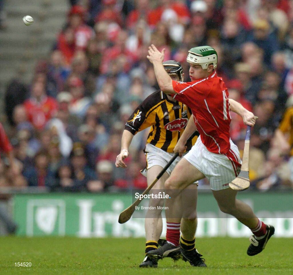 12 September 2004; Niall McCarthy, Cork, in action against Peter Barry, Kilkenny. Guinness All-Ireland Senior Hurling Championship Final, Cork v Kilkenny, Croke Park, Dublin. Picture credit; Brendan Moran / SPORTSFILE *** Local Caption *** Any photograph taken by SPORTSFILE during, or in connection with, the 2004 Guinness All-Ireland Hurling Final which displays GAA logos or contains an image or part of an image of any GAA intellectual property, or, which contains images of a GAA player/players in their playing uniforms, may only be used for editorial and non-advertising purposes.  Use of photographs for advertising, as posters or for purchase separately is strictly prohibited unless prior written approval has been obtained from the Gaelic Athletic Association.