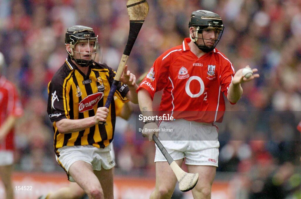 12 September 2004; Wayne Sherlock, Cork, in action against Martin Comerford, Kilkenny. Guinness All-Ireland Senior Hurling Championship Final, Cork v Kilkenny, Croke Park, Dublin. Picture credit; Brendan Moran / SPORTSFILE *** Local Caption *** Any photograph taken by SPORTSFILE during, or in connection with, the 2004 Guinness All-Ireland Hurling Final which displays GAA logos or contains an image or part of an image of any GAA intellectual property, or, which contains images of a GAA player/players in their playing uniforms, may only be used for editorial and non-advertising purposes.  Use of photographs for advertising, as posters or for purchase separately is strictly prohibited unless prior written approval has been obtained from the Gaelic Athletic Association.
