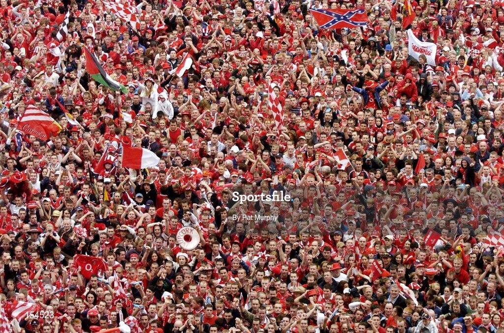 12 September 2004; Cork fans celebrate victory over Kilkenny. Guinness All-Ireland Senior Hurling Championship Final, Cork v Kilkenny, Croke Park, Dublin. Picture credit; Pat Murphy / SPORTSFILE *** Local Caption *** Any photograph taken by SPORTSFILE during, or in connection with, the 2004 Guinness All-Ireland Hurling Final which displays GAA logos or contains an image or part of an image of any GAA intellectual property, or, which contains images of a GAA player/players in their playing uniforms, may only be used for editorial and non-advertising purposes.  Use of photographs for advertising, as posters or for purchase separately is strictly prohibited unless prior written approval has been obtained from the Gaelic Athletic Association.
