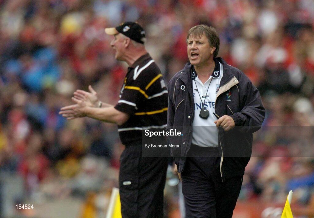 12 September 2004; Cork manager Donal O'Grady, right, and Kilkenny manager Brian Cody encourage their respective sides. Guinness All-Ireland Senior Hurling Championship Final, Cork v Kilkenny, Croke Park, Dublin. Picture credit; Brendan Moran / SPORTSFILE *** Local Caption *** Any photograph taken by SPORTSFILE during, or in connection with, the 2004 Guinness All-Ireland Hurling Final which displays GAA logos or contains an image or part of an image of any GAA intellectual property, or, which contains images of a GAA player/players in their playing uniforms, may only be used for editorial and non-advertising purposes.  Use of photographs for advertising, as posters or for purchase separately is strictly prohibited unless prior written approval has been obtained from the Gaelic Athletic Association.