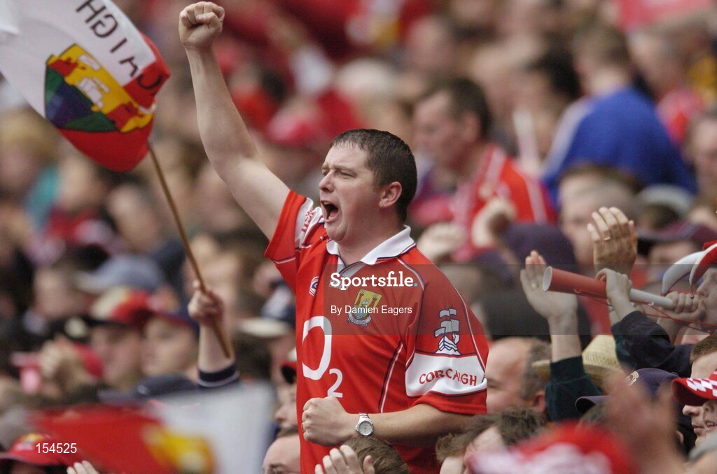 12 September 2004; A Cork supporter celebrates another point during the match. Guinness All-Ireland Senior Hurling Championship Final, Cork v Kilkenny, Croke Park, Dublin. Picture credit; Damien Eagers / SPORTSFILE *** Local Caption *** Any photograph taken by SPORTSFILE during, or in connection with, the 2004 Guinness All-Ireland Hurling Final which displays GAA logos or contains an image or part of an image of any GAA intellectual property, or, which contains images of a GAA player/players in their playing uniforms, may only be used for editorial and non-advertising purposes.  Use of photographs for advertising, as posters or for purchase separately is strictly prohibited unless prior written approval has been obtained from the Gaelic Athletic Association.