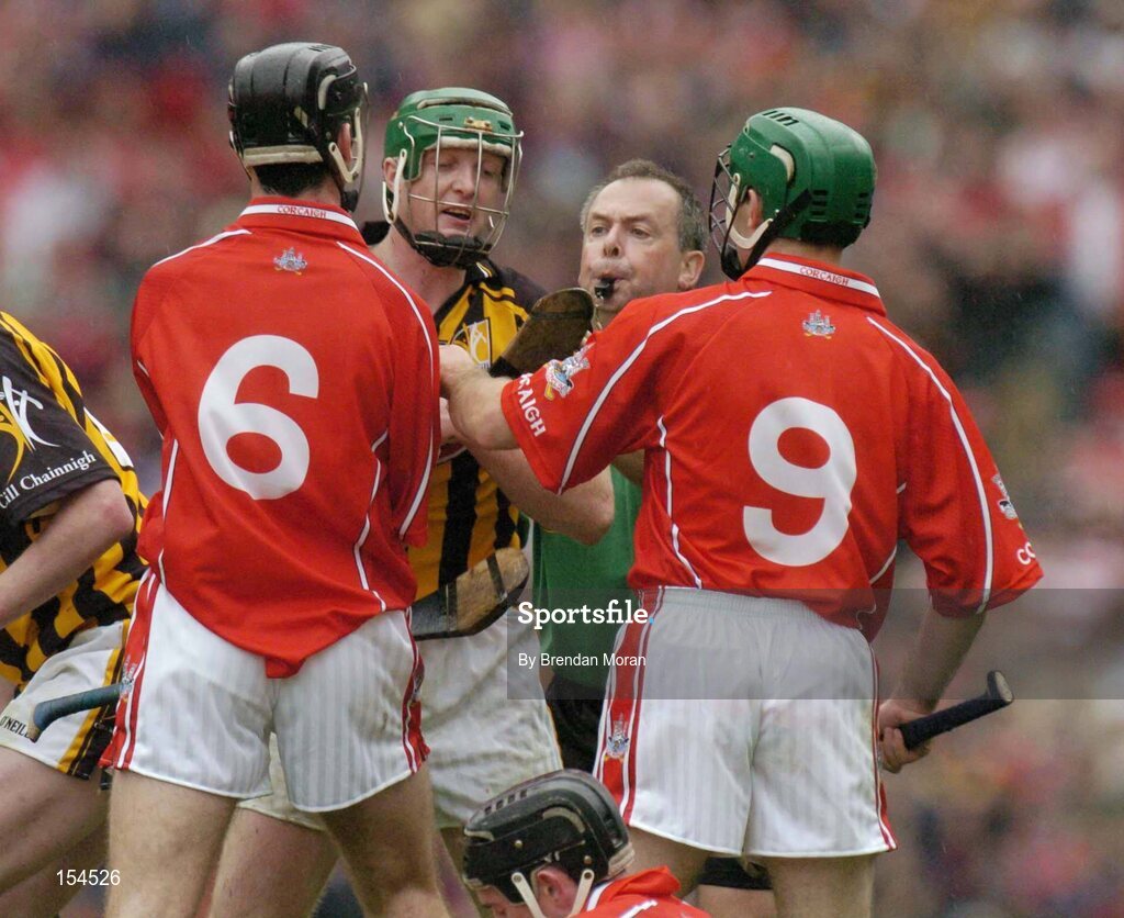 12 September 2004; Referee Aodan MacSuibhne attempts to separate Kilkenny's Henry Shefflin from Cork's Ronan Curran (6) and Jerry O'Connor (9). Guinness All-Ireland Senior Hurling Championship Final, Cork v Kilkenny, Croke Park, Dublin. Picture credit; Brendan Moran / SPORTSFILE *** Local Caption *** Any photograph taken by SPORTSFILE during, or in connection with, the 2004 Guinness All-Ireland Hurling Final which displays GAA logos or contains an image or part of an image of any GAA intellectual property, or, which contains images of a GAA player/players in their playing uniforms, may only be used for editorial and non-advertising purposes.  Use of photographs for advertising, as posters or for purchase separately is strictly prohibited unless prior written approval has been obtained from the Gaelic Athletic Association.