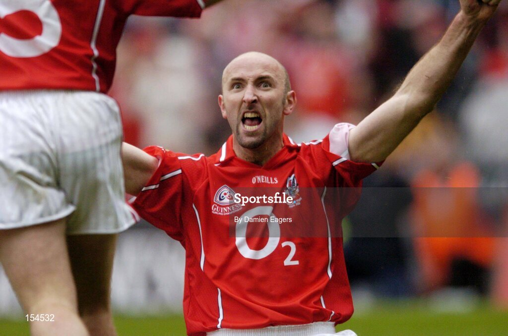 12 September 2004; Cork's Brian Corcoran celebrates after victory over Kilkenny. Guinness All-Ireland Senior Hurling Championship Final, Cork v Kilkenny, Croke Park, Dublin. Picture credit; Damien Eagers / SPORTSFILE *** Local Caption *** Any photograph taken by SPORTSFILE during, or in connection with, the 2004 Guinness All-Ireland Hurling Final which displays GAA logos or contains an image or part of an image of any GAA intellectual property, or, which contains images of a GAA player/players in their playing uniforms, may only be used for editorial and non-advertising purposes.  Use of photographs for advertising, as posters or for purchase separately is strictly prohibited unless prior written approval has been obtained from the Gaelic Athletic Association.