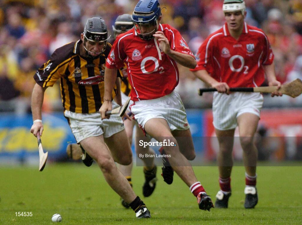 12 September 2004; Tom Kenny, Cork, in action against Ken Coogan, Kilkenny. Guinness All-Ireland Senior Hurling Championship Final, Cork v Kilkenny, Croke Park, Dublin. Picture credit; Brian Lawless / SPORTSFILE *** Local Caption *** Any photograph taken by SPORTSFILE during, or in connection with, the 2004 Guinness All-Ireland Hurling Final which displays GAA logos or contains an image or part of an image of any GAA intellectual property, or, which contains images of a GAA player/players in their playing uniforms, may only be used for editorial and non-advertising purposes.  Use of photographs for advertising, as posters or for purchase separately is strictly prohibited unless prior written approval has been obtained from the Gaelic Athletic Association.