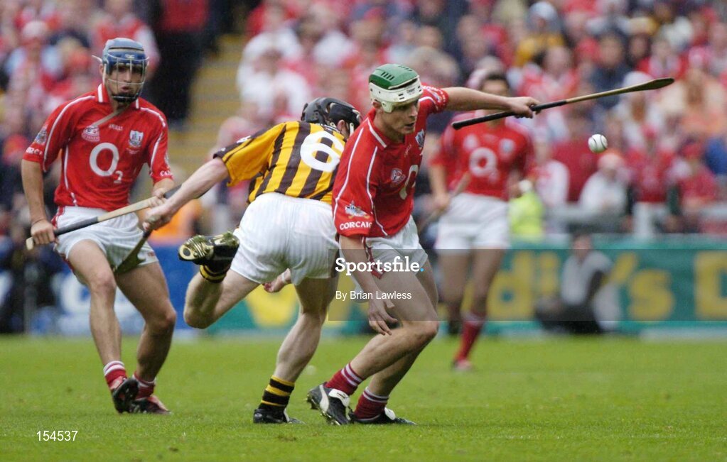 12 September 2004; Niall McCarthy, Cork, in action against Peter Barry, Kilkenny. Guinness All-Ireland Senior Hurling Championship Final, Cork v Kilkenny, Croke Park, Dublin. Picture credit; Brian Lawless / SPORTSFILE *** Local Caption *** Any photograph taken by SPORTSFILE during, or in connection with, the 2004 Guinness All-Ireland Hurling Final which displays GAA logos or contains an image or part of an image of any GAA intellectual property, or, which contains images of a GAA player/players in their playing uniforms, may only be used for editorial and non-advertising purposes.  Use of photographs for advertising, as posters or for purchase separately is strictly prohibited unless prior written approval has been obtained from the Gaelic Athletic Association.