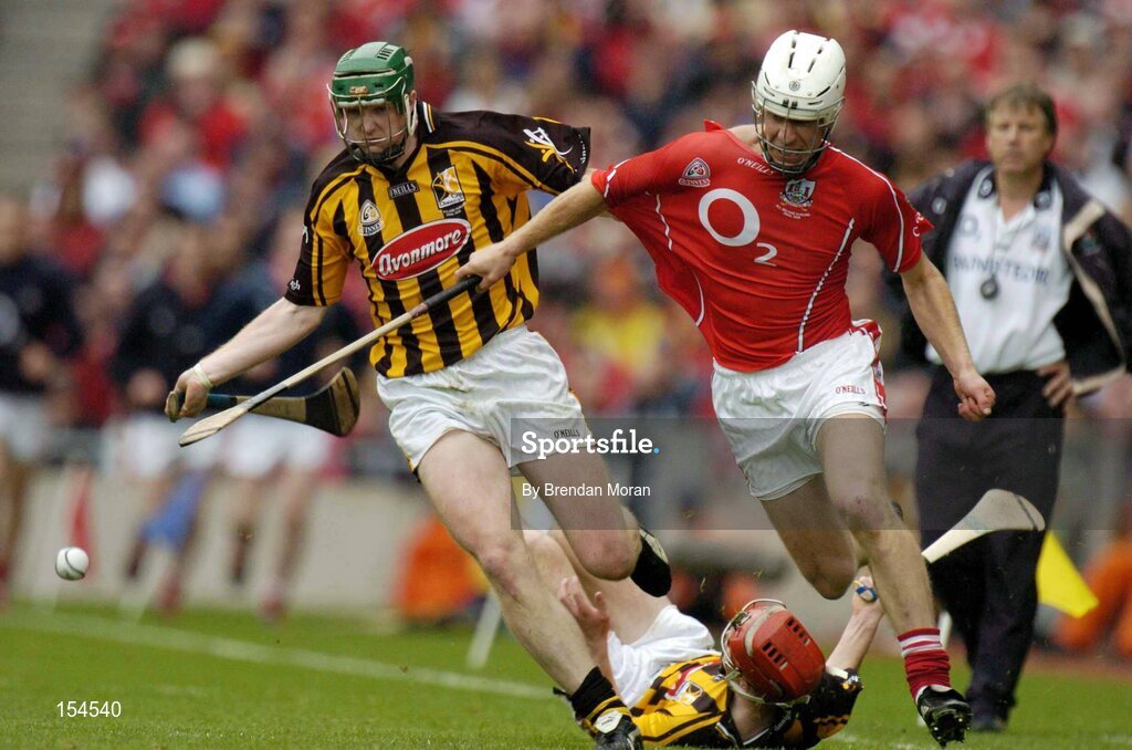 12 September 2004; Timmy McCarthy, Cork, right, in a race for possession with Henry Shefflin, Kilkenny. Guinness All-Ireland Senior Hurling Championship Final, Cork v Kilkenny, Croke Park, Dublin. Picture credit; Brendan Moran / SPORTSFILE *** Local Caption *** Any photograph taken by SPORTSFILE during, or in connection with, the 2004 Guinness All-Ireland Hurling Final which displays GAA logos or contains an image or part of an image of any GAA intellectual property, or, which contains images of a GAA player/players in their playing uniforms, may only be used for editorial and non-advertising purposes.  Use of photographs for advertising, as posters or for purchase separately is strictly prohibited unless prior written approval has been obtained from the Gaelic Athletic Association.