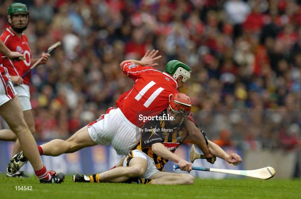 12 September 2004; Tommy Walsh, Kilkenny, in action against Niall McCarthy, Cork. Guinness All-Ireland Senior Hurling Championship Final, Cork v Kilkenny, Croke Park, Dublin. Picture credit; Brendan Moran / SPORTSFILE *** Local Caption *** Any photograph taken by SPORTSFILE during, or in connection with, the 2004 Guinness All-Ireland Hurling Final which displays GAA logos or contains an image or part of an image of any GAA intellectual property, or, which contains images of a GAA player/players in their playing uniforms, may only be used for editorial and non-advertising purposes.  Use of photographs for advertising, as posters or for purchase separately is strictly prohibited unless prior written approval has been obtained from the Gaelic Athletic Association.