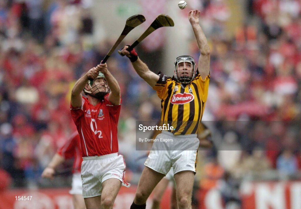 12 September 2004; D.J Carey,  Kilkenny, in action against Jerry O'Connor, Cork. Guinness All-Ireland Senior Hurling Championship Final, Cork v Kilkenny, Croke Park, Dublin. Picture credit; Damien Eagers / SPORTSFILE *** Local Caption *** Any photograph taken by SPORTSFILE during, or in connection with, the 2004 Guinness All-Ireland Hurling Final which displays GAA logos or contains an image or part of an image of any GAA intellectual property, or, which contains images of a GAA player/players in their playing uniforms, may only be used for editorial and non-advertising purposes.  Use of photographs for advertising, as posters or for purchase separately is strictly prohibited unless prior written approval has been obtained from the Gaelic Athletic Association.
