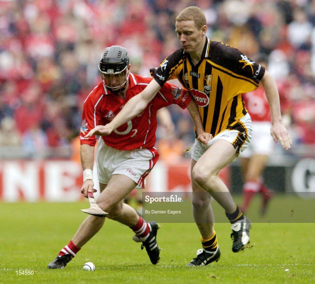 12 September 2004; Ben O'Connor, Cork, in action against James Ryall, Kilkenny. Guinness All-Ireland Senior Hurling Championship Final, Cork v Kilkenny, Croke Park, Dublin. Picture credit; Damien Eagers / SPORTSFILE *** Local Caption *** Any photograph taken by SPORTSFILE during, or in connection with, the 2004 Guinness All-Ireland Hurling Final which displays GAA logos or contains an image or part of an image of any GAA intellectual property, or, which contains images of a GAA player/players in their playing uniforms, may only be used for editorial and non-advertising purposes.  Use of photographs for advertising, as posters or for purchase separately is strictly prohibited unless prior written approval has been obtained from the Gaelic Athletic Association.