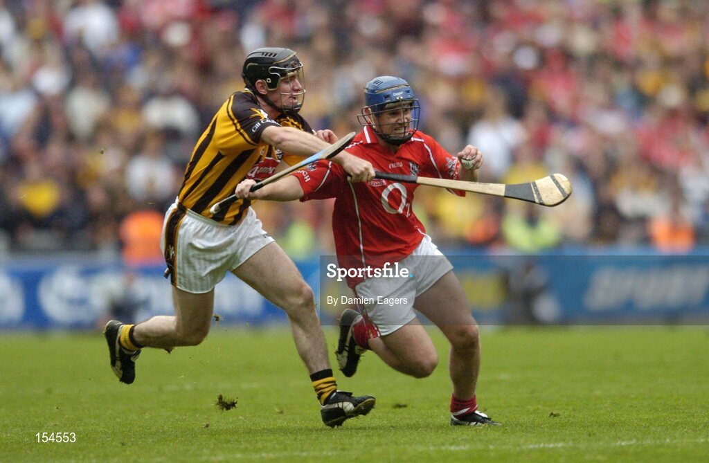 12 September 2004; Kieran Murphy, Cork, in action against Noel Hickey, Kilkenny. Guinness All-Ireland Senior Hurling Championship Final, Cork v Kilkenny, Croke Park, Dublin. Picture credit; Damien Eagers / SPORTSFILE *** Local Caption *** Any photograph taken by SPORTSFILE during, or in connection with, the 2004 Guinness All-Ireland Hurling Final which displays GAA logos or contains an image or part of an image of any GAA intellectual property, or, which contains images of a GAA player/players in their playing uniforms, may only be used for editorial and non-advertising purposes.  Use of photographs for advertising, as posters or for purchase separately is strictly prohibited unless prior written approval has been obtained from the Gaelic Athletic Association.