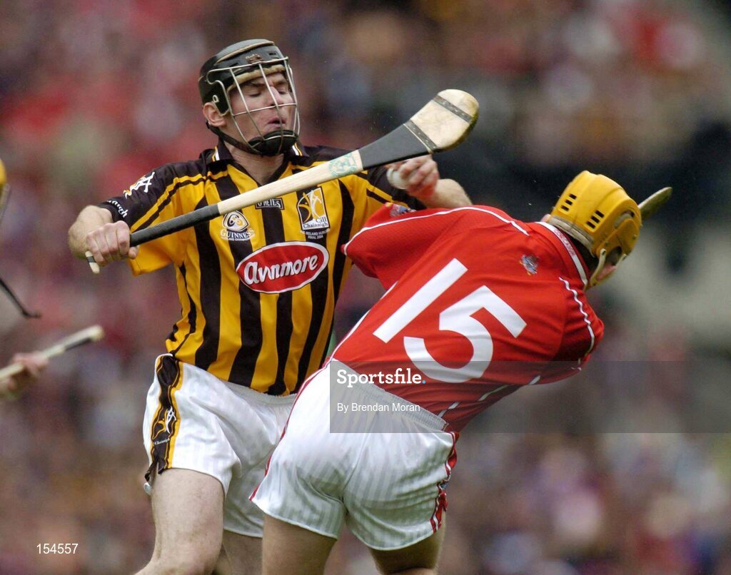 12 September 2004; Noel Hickey, Kilkenny, in action against Joe Deane, Cork. Guinness All-Ireland Senior Hurling Championship Final, Cork v Kilkenny, Croke Park, Dublin. Picture credit; Brendan Moran / SPORTSFILE *** Local Caption *** Any photograph taken by SPORTSFILE during, or in connection with, the 2004 Guinness All-Ireland Hurling Final which displays GAA logos or contains an image or part of an image of any GAA intellectual property, or, which contains images of a GAA player/players in their playing uniforms, may only be used for editorial and non-advertising purposes.  Use of photographs for advertising, as posters or for purchase separately is strictly prohibited unless prior written approval has been obtained from the Gaelic Athletic Association.