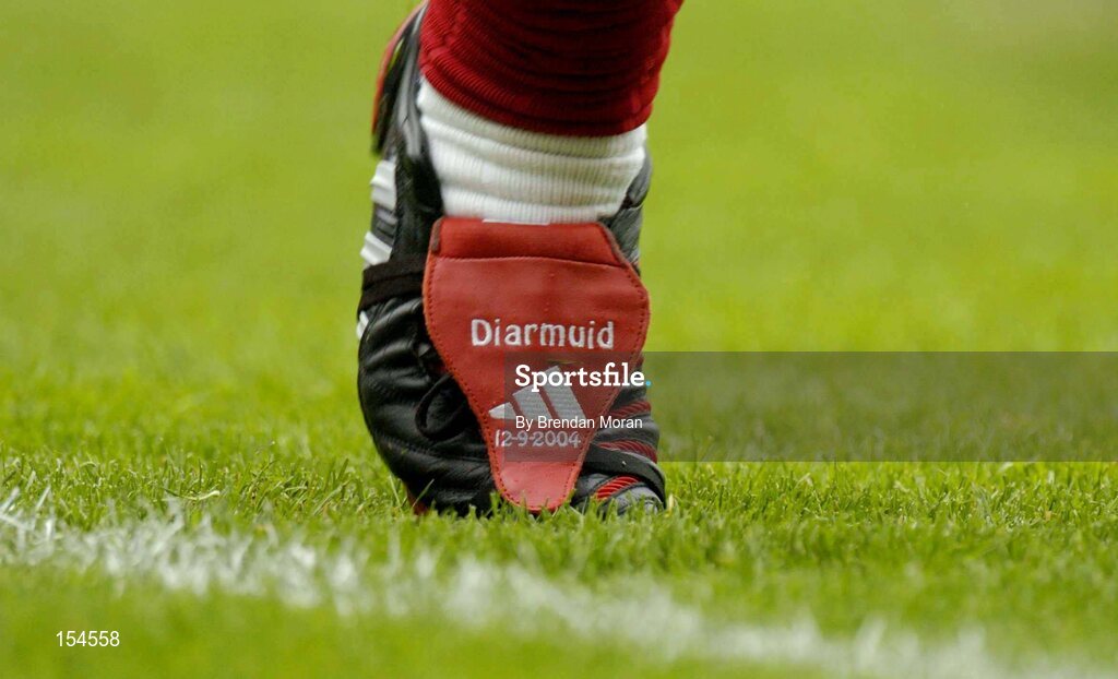 12 September 2004; Cork full-back Diarmuid O'Sullivan with his customised boots during the game. Guinness All-Ireland Senior Hurling Championship Final, Cork v Kilkenny, Croke Park, Dublin. Picture credit; Brendan Moran / SPORTSFILE *** Local Caption *** Any photograph taken by SPORTSFILE during, or in connection with, the 2004 Guinness All-Ireland Hurling Final which displays GAA logos or contains an image or part of an image of any GAA intellectual property, or, which contains images of a GAA player/players in their playing uniforms, may only be used for editorial and non-advertising purposes.  Use of photographs for advertising, as posters or for purchase separately is strictly prohibited unless prior written approval has been obtained from the Gaelic Athletic Association.