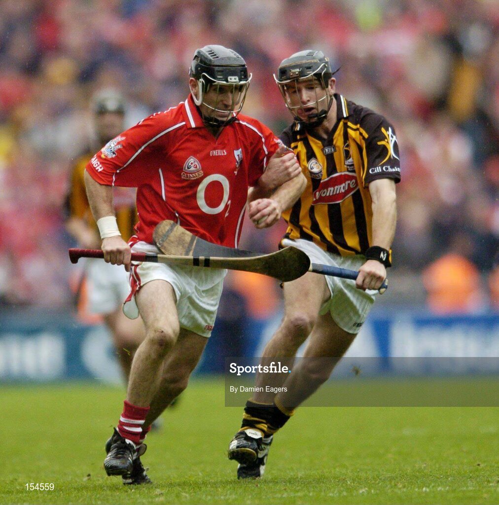 12 September 2004; Ben O'Connor, Cork, in action against J.J Delaney, Kilkenny. Guinness All-Ireland Senior Hurling Championship Final, Cork v Kilkenny, Croke Park, Dublin. Picture credit; Damien Eagers / SPORTSFILE *** Local Caption *** Any photograph taken by SPORTSFILE during, or in connection with, the 2004 Guinness All-Ireland Hurling Final which displays GAA logos or contains an image or part of an image of any GAA intellectual property, or, which contains images of a GAA player/players in their playing uniforms, may only be used for editorial and non-advertising purposes.  Use of photographs for advertising, as posters or for purchase separately is strictly prohibited unless prior written approval has been obtained from the Gaelic Athletic Association.