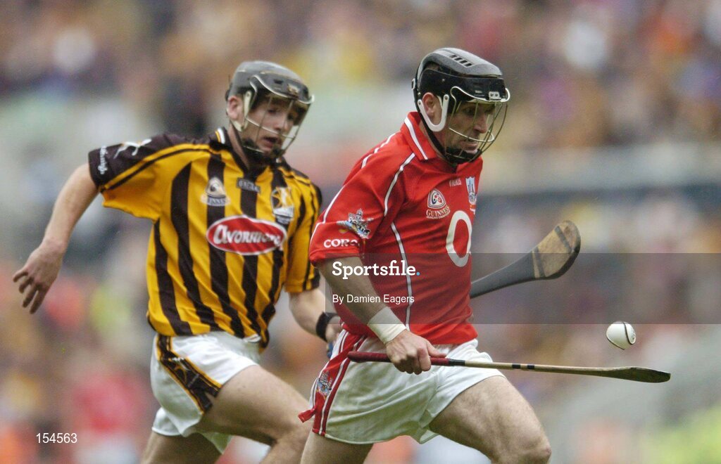12 September 2004; Ben O'Connor of Cork in action against J.J Delaney of Kilkenny during the Guinness All-Ireland Senior Hurling Championship Final match between Cork and Kilkenny at Croke Park in Dublin. Photo by Damien Eagers/Sportsfile *** Local Caption *** Any photograph taken by SPORTSFILE during, or in connection with, the 2004 Guinness All-Ireland Hurling Final which displays GAA logos or contains an image or part of an image of any GAA intellectual property, or, which contains images of a GAA player/players in their playing uniforms, may only be used for editorial and non-advertising purposes.  Use of photographs for advertising, as posters or for purchase separately is strictly prohibited unless prior written approval has been obtained from the Gaelic Athletic Association.