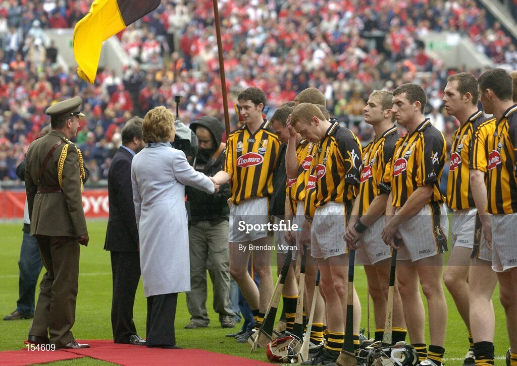 12 September 2004; President of Ireland Mary McAleese is introduced to Kilkenny captain Martin Comerford. Guinness All-Ireland Senior Hurling Championship Final, Cork v Kilkenny, Croke Park, Dublin. Picture credit; Brendan Moran / SPORTSFILE *** Local Caption *** Any photograph taken by SPORTSFILE during, or in connection with, the 2004 Guinness All-Ireland Hurling Final which displays GAA logos or contains an image or part of an image of any GAA intellectual property, or, which contains images of a GAA player/players in their playing uniforms, may only be used for editorial and non-advertising purposes.  Use of photographs for advertising, as posters or for purchase separately is strictly prohibited unless prior written approval has been obtained from the Gaelic Athletic Association.