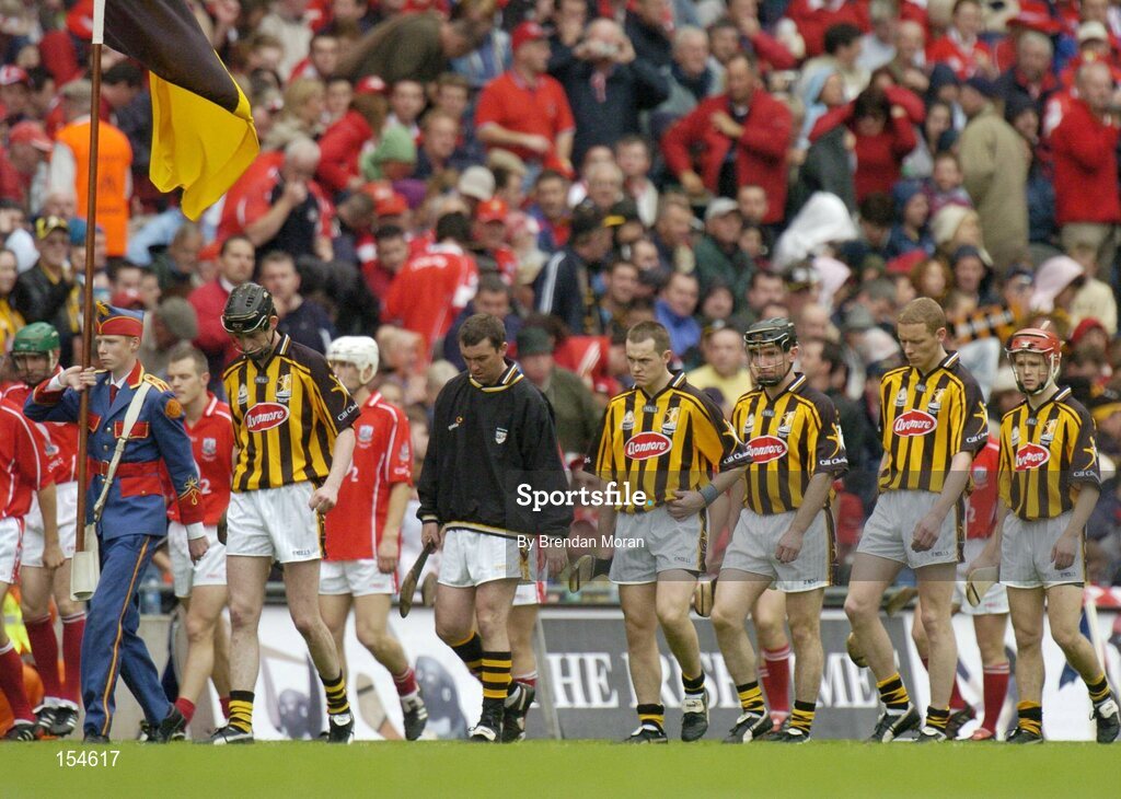 12 September 2004; Kilkenny captain Martin Comerford leads his side in the pre-match parade. Guinness All-Ireland Senior Hurling Championship Final, Cork v Kilkenny, Croke Park, Dublin. Picture credit; Brendan Moran / SPORTSFILE *** Local Caption *** Any photograph taken by SPORTSFILE during, or in connection with, the 2004 Guinness All-Ireland Hurling Final which displays GAA logos or contains an image or part of an image of any GAA intellectual property, or, which contains images of a GAA player/players in their playing uniforms, may only be used for editorial and non-advertising purposes.  Use of photographs for advertising, as posters or for purchase separately is strictly prohibited unless prior written approval has been obtained from the Gaelic Athletic Association.