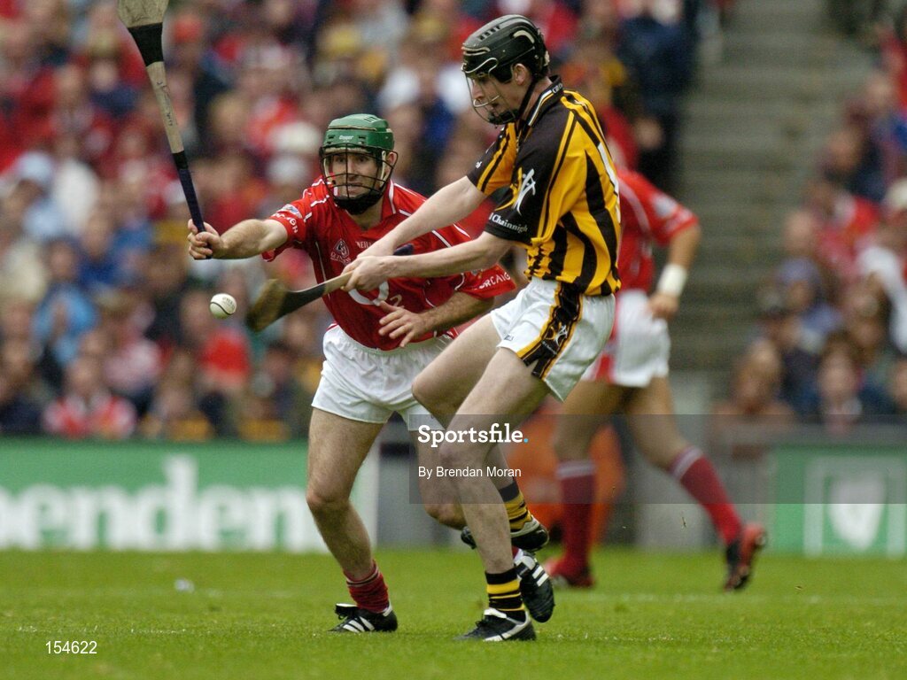 12 September 2004; Martin Comerford, Kilkenny, in action against Jerry O'Connor, Cork. Guinness All-Ireland Senior Hurling Championship Final, Cork v Kilkenny, Croke Park, Dublin. Picture credit; Brendan Moran / SPORTSFILE *** Local Caption *** Any photograph taken by SPORTSFILE during, or in connection with, the 2004 Guinness All-Ireland Hurling Final which displays GAA logos or contains an image or part of an image of any GAA intellectual property, or, which contains images of a GAA player/players in their playing uniforms, may only be used for editorial and non-advertising purposes.  Use of photographs for advertising, as posters or for purchase separately is strictly prohibited unless prior written approval has been obtained from the Gaelic Athletic Association.