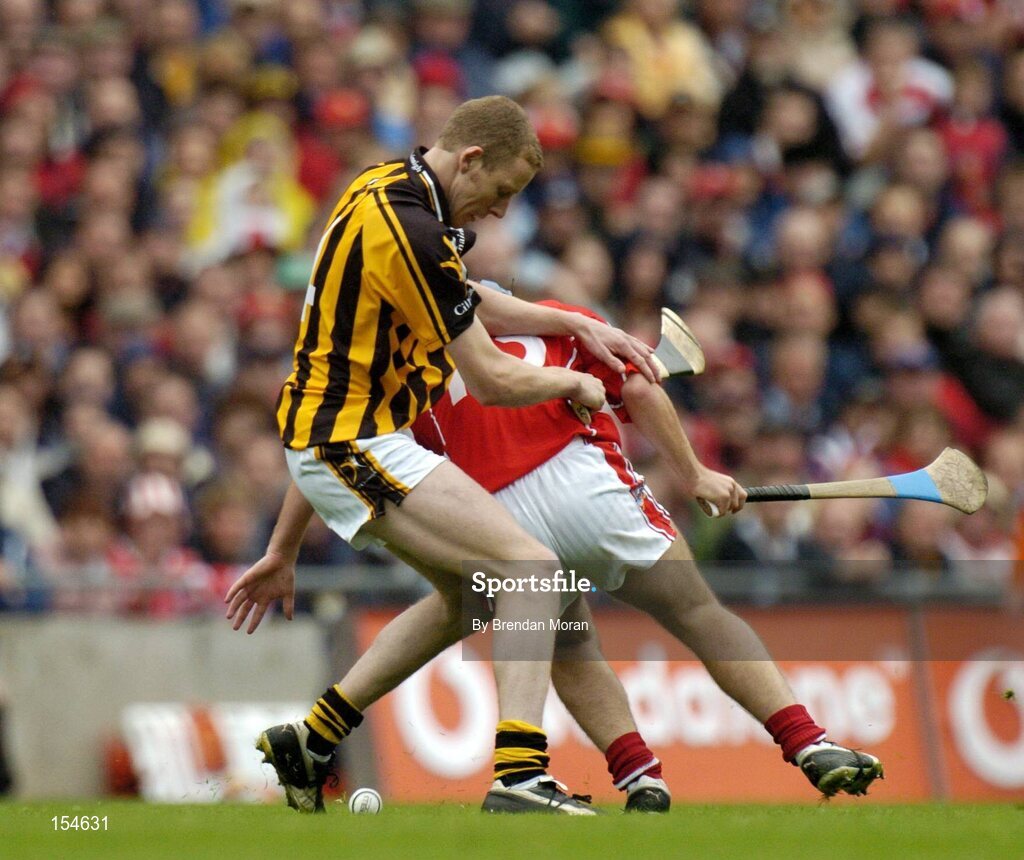 12 September 2004; James Ryall, Kilkenny, in action against Kieran Murphy, Cork. Guinness All-Ireland Senior Hurling Championship Final, Cork v Kilkenny, Croke Park, Dublin. Picture credit; Brendan Moran / SPORTSFILE *** Local Caption *** Any photograph taken by SPORTSFILE during, or in connection with, the 2004 Guinness All-Ireland Hurling Final which displays GAA logos or contains an image or part of an image of any GAA intellectual property, or, which contains images of a GAA player/players in their playing uniforms, may only be used for editorial and non-advertising purposes.  Use of photographs for advertising, as posters or for purchase separately is strictly prohibited unless prior written approval has been obtained from the Gaelic Athletic Association.