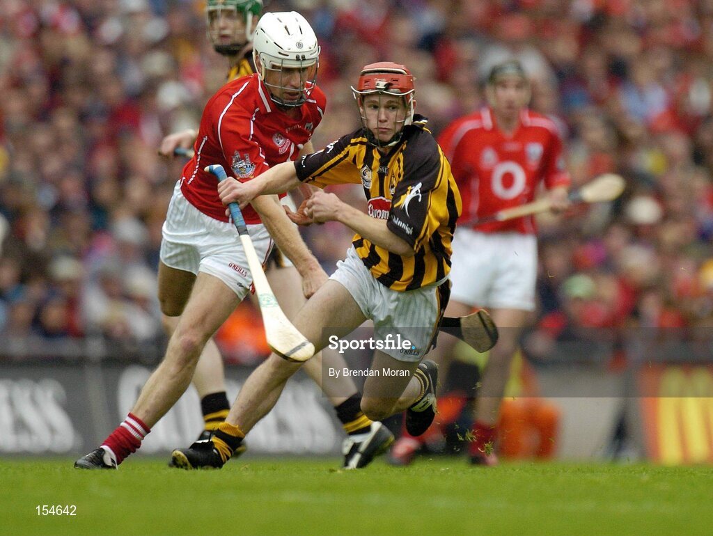 12 September 2004; Tommy Walsh, Kilkenny, in action against Timmy McCarthy, Cork. Guinness All-Ireland Senior Hurling Championship Final, Cork v Kilkenny, Croke Park, Dublin. Picture credit; Brendan Moran / SPORTSFILE *** Local Caption *** Any photograph taken by SPORTSFILE during, or in connection with, the 2004 Guinness All-Ireland Hurling Final which displays GAA logos or contains an image or part of an image of any GAA intellectual property, or, which contains images of a GAA player/players in their playing uniforms, may only be used for editorial and non-advertising purposes.  Use of photographs for advertising, as posters or for purchase separately is strictly prohibited unless prior written approval has been obtained from the Gaelic Athletic Association.