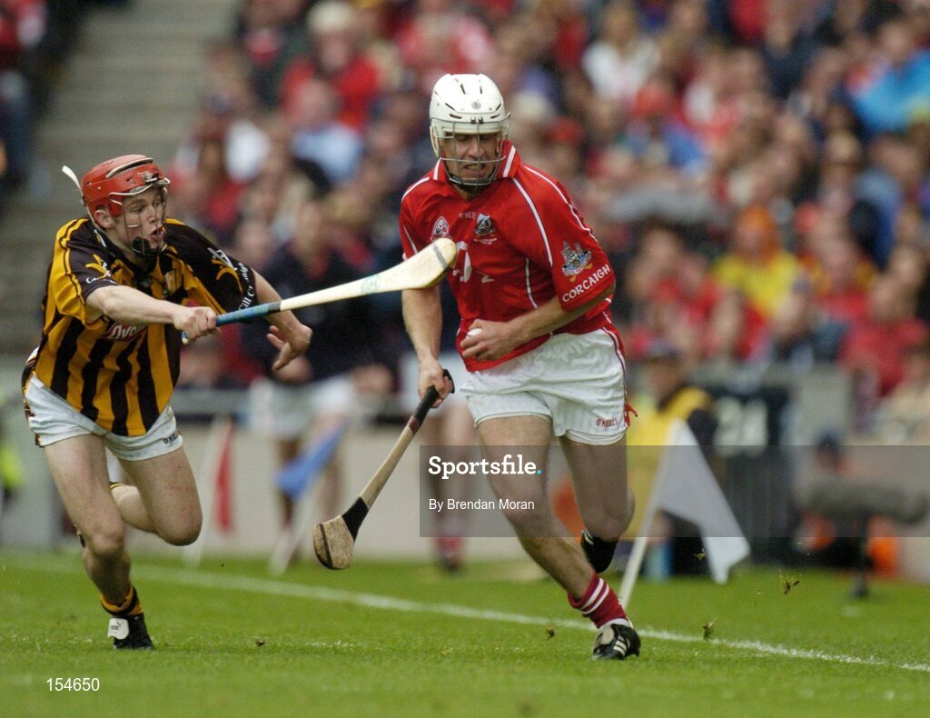12 September 2004; Tommy McCarthy, Cork, in action against Tommy Walsh, Kilkenny. Guinness All-Ireland Senior Hurling Championship Final, Cork v Kilkenny, Croke Park, Dublin. Picture credit; Brendan Moran / SPORTSFILE *** Local Caption *** Any photograph taken by SPORTSFILE during, or in connection with, the 2004 Guinness All-Ireland Hurling Final which displays GAA logos or contains an image or part of an image of any GAA intellectual property, or, which contains images of a GAA player/players in their playing uniforms, may only be used for editorial and non-advertising purposes.  Use of photographs for advertising, as posters or for purchase separately is strictly prohibited unless prior written approval has been obtained from the Gaelic Athletic Association.