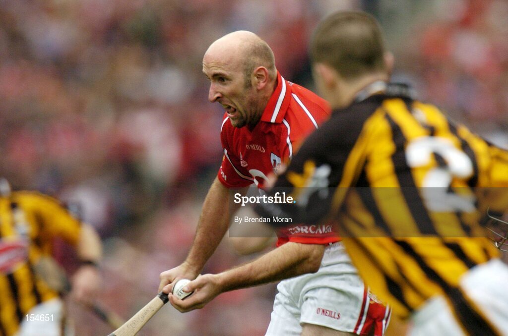 12 September 2004; Brian Corcoran, Cork, in action against Kilkenny. Guinness All-Ireland Senior Hurling Championship Final, Cork v Kilkenny, Croke Park, Dublin. Picture credit; Brendan Moran / SPORTSFILE *** Local Caption *** Any photograph taken by SPORTSFILE during, or in connection with, the 2004 Guinness All-Ireland Hurling Final which displays GAA logos or contains an image or part of an image of any GAA intellectual property, or, which contains images of a GAA player/players in their playing uniforms, may only be used for editorial and non-advertising purposes.  Use of photographs for advertising, as posters or for purchase separately is strictly prohibited unless prior written approval has been obtained from the Gaelic Athletic Association.