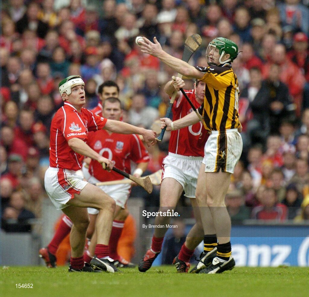 12 September 2004; Henry Shefflin, Kilkenny, in action against Niall McCarthy, left, and John Gardiner, Cork. Guinness All-Ireland Senior Hurling Championship Final, Cork v Kilkenny, Croke Park, Dublin. Picture credit; Brendan Moran / SPORTSFILE *** Local Caption *** Any photograph taken by SPORTSFILE during, or in connection with, the 2004 Guinness All-Ireland Hurling Final which displays GAA logos or contains an image or part of an image of any GAA intellectual property, or, which contains images of a GAA player/players in their playing uniforms, may only be used for editorial and non-advertising purposes.  Use of photographs for advertising, as posters or for purchase separately is strictly prohibited unless prior written approval has been obtained from the Gaelic Athletic Association.