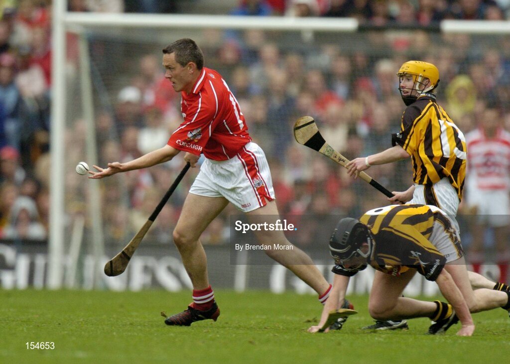 12 September 2004; John Browne, Cork, in action against Derek Lyng and James Fitzpatrick (13), Kilkenny. Guinness All-Ireland Senior Hurling Championship Final, Cork v Kilkenny, Croke Park, Dublin. Picture credit; Brendan Moran / SPORTSFILE *** Local Caption *** Any photograph taken by SPORTSFILE during, or in connection with, the 2004 Guinness All-Ireland Hurling Final which displays GAA logos or contains an image or part of an image of any GAA intellectual property, or, which contains images of a GAA player/players in their playing uniforms, may only be used for editorial and non-advertising purposes.  Use of photographs for advertising, as posters or for purchase separately is strictly prohibited unless prior written approval has been obtained from the Gaelic Athletic Association.