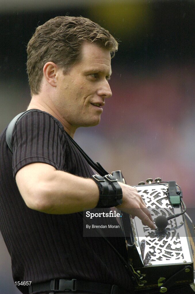 12 September 2004; Musician Liam O'Connor entertains the crowd at half-time. Guinness All-Ireland Senior Hurling Championship Final, Cork v Kilkenny, Croke Park, Dublin. Picture credit; Brendan Moran / SPORTSFILE *** Local Caption *** Any photograph taken by SPORTSFILE during, or in connection with, the 2004 Guinness All-Ireland Hurling Final which displays GAA logos or contains an image or part of an image of any GAA intellectual property, or, which contains images of a GAA player/players in their playing uniforms, may only be used for editorial and non-advertising purposes.  Use of photographs for advertising, as posters or for purchase separately is strictly prohibited unless prior written approval has been obtained from the Gaelic Athletic Association.