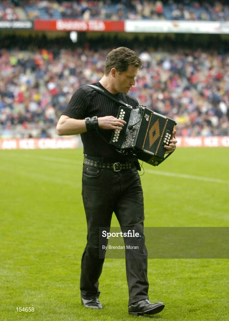 12 September 2004; Musician Liam O'Connor entertains the crowd at half-time. Guinness All-Ireland Senior Hurling Championship Final, Cork v Kilkenny, Croke Park, Dublin. Picture credit; Brendan Moran / SPORTSFILE *** Local Caption *** Any photograph taken by SPORTSFILE during, or in connection with, the 2004 Guinness All-Ireland Hurling Final which displays GAA logos or contains an image or part of an image of any GAA intellectual property, or, which contains images of a GAA player/players in their playing uniforms, may only be used for editorial and non-advertising purposes.  Use of photographs for advertising, as posters or for purchase separately is strictly prohibited unless prior written approval has been obtained from the Gaelic Athletic Association.