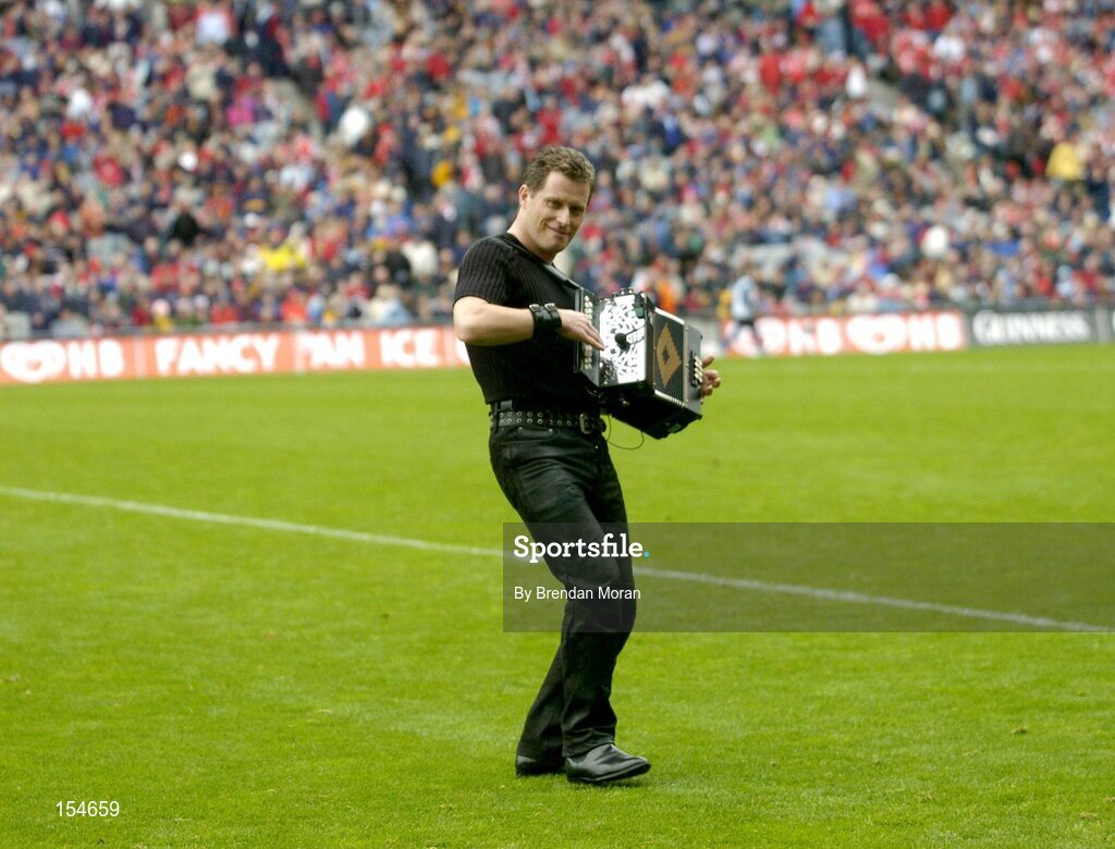 12 September 2004; Musician Liam O'Connor entertains the crowd at half-time. Guinness All-Ireland Senior Hurling Championship Final, Cork v Kilkenny, Croke Park, Dublin. Picture credit; Brendan Moran / SPORTSFILE *** Local Caption *** Any photograph taken by SPORTSFILE during, or in connection with, the 2004 Guinness All-Ireland Hurling Final which displays GAA logos or contains an image or part of an image of any GAA intellectual property, or, which contains images of a GAA player/players in their playing uniforms, may only be used for editorial and non-advertising purposes.  Use of photographs for advertising, as posters or for purchase separately is strictly prohibited unless prior written approval has been obtained from the Gaelic Athletic Association.