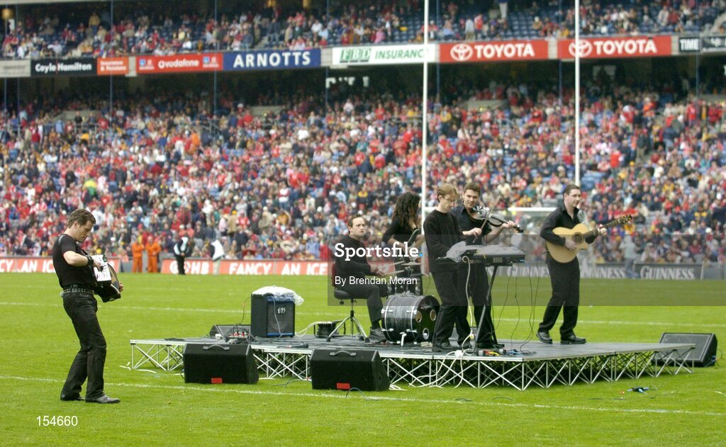 12 September 2004; Musician Liam O'Connor, left, and his band entertain the crowd at half-time. Guinness All-Ireland Senior Hurling Championship Final, Cork v Kilkenny, Croke Park, Dublin. Picture credit; Brendan Moran / SPORTSFILE *** Local Caption *** Any photograph taken by SPORTSFILE during, or in connection with, the 2004 Guinness All-Ireland Hurling Final which displays GAA logos or contains an image or part of an image of any GAA intellectual property, or, which contains images of a GAA player/players in their playing uniforms, may only be used for editorial and non-advertising purposes.  Use of photographs for advertising, as posters or for purchase separately is strictly prohibited unless prior written approval has been obtained from the Gaelic Athletic Association.
